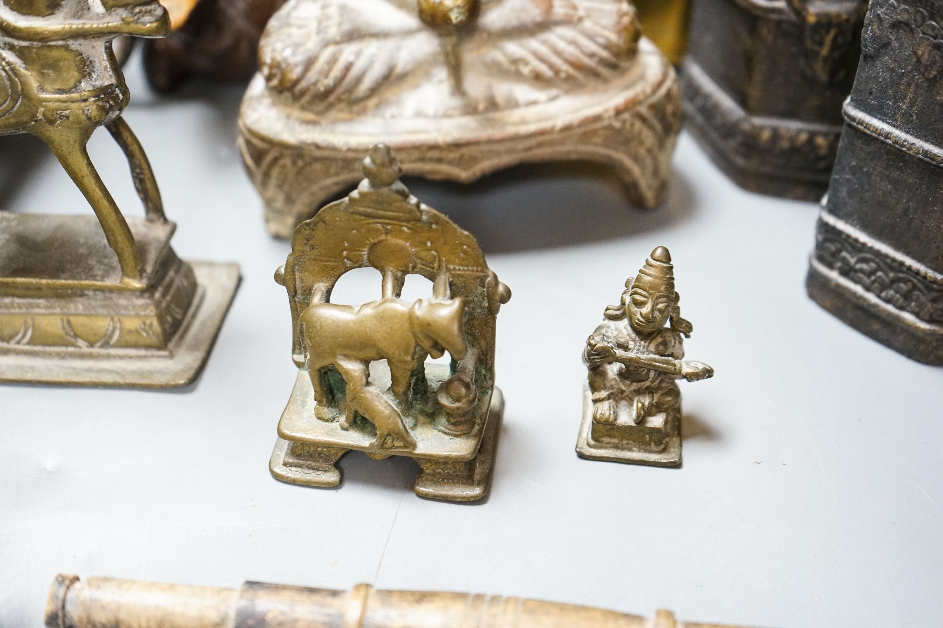 A group of Indian brass and wood figures and a Chinese wood figure